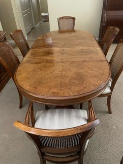Vintage Pedestal Dining Table with 6 Cane Back Chairs and matching china cabinet