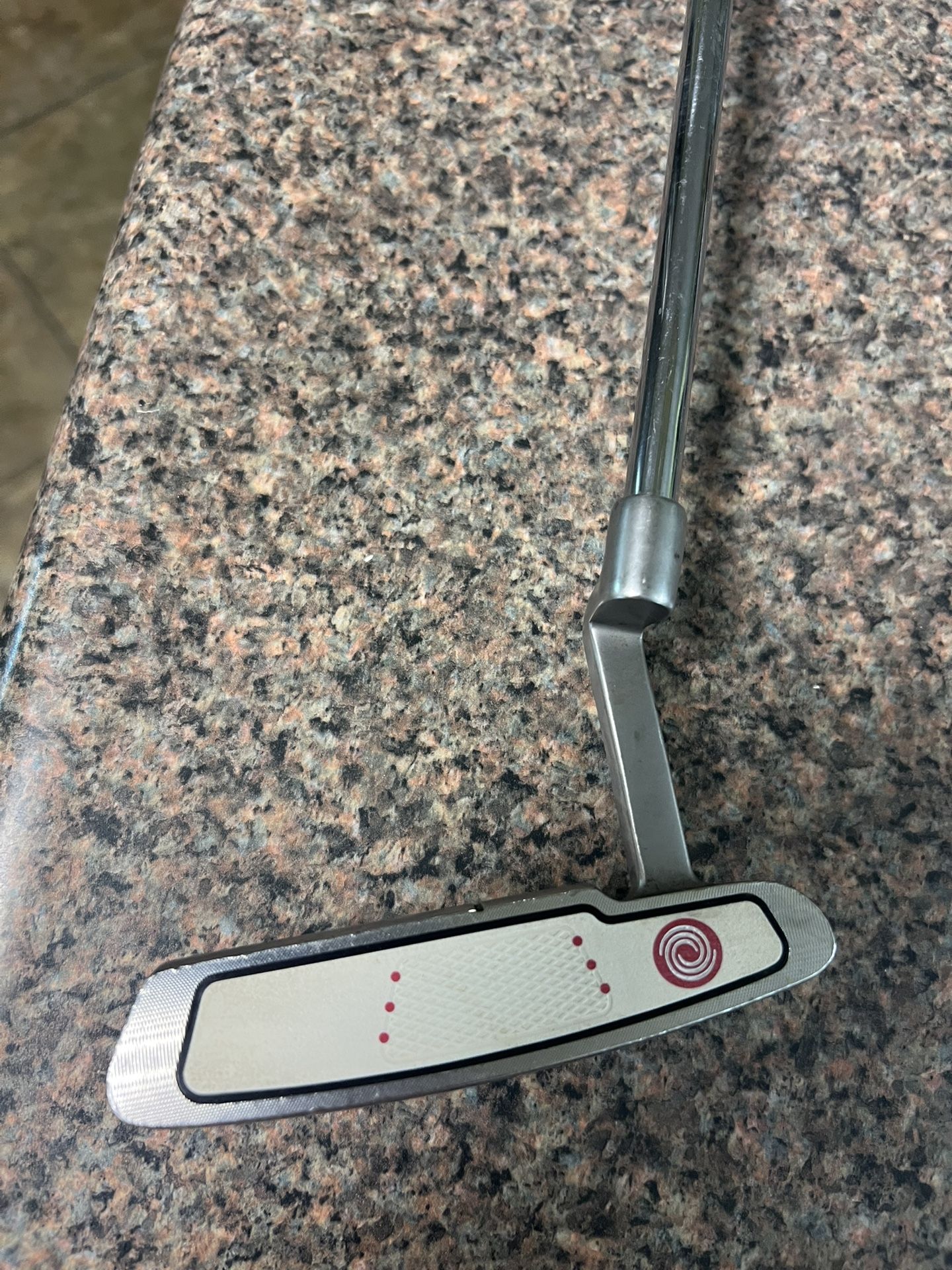 putter, Odyssey, white hat, 36 inch, balotta face for better roll, fat boy, grip wrapped in red, time for you to pick up three or four strokes / a rou