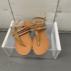 brown strappy flat sandals with rhinestone embellishments