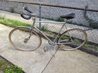 Silver Nishiki single speed road bike w bullhorn and freewheel