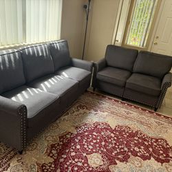 Like New 2-Piece Dark Gray Sofa Set – Barely Used, Delivery Available”