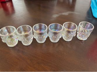 6 skull shot glasses and 2 beer mugs