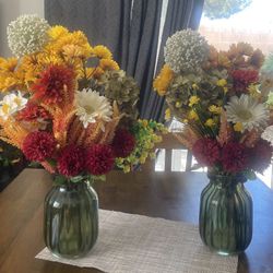 2 green glass vases with faux flowers included. 