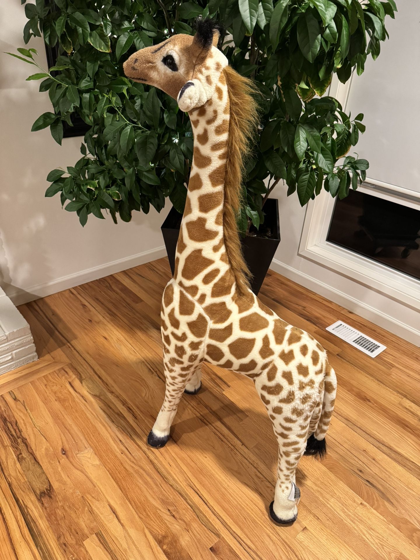 Melissa & Doug giraffe stuffed animal.