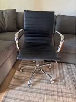 black faux leather and chrome executive office chair