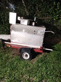 Hot dog cart and a propane tank