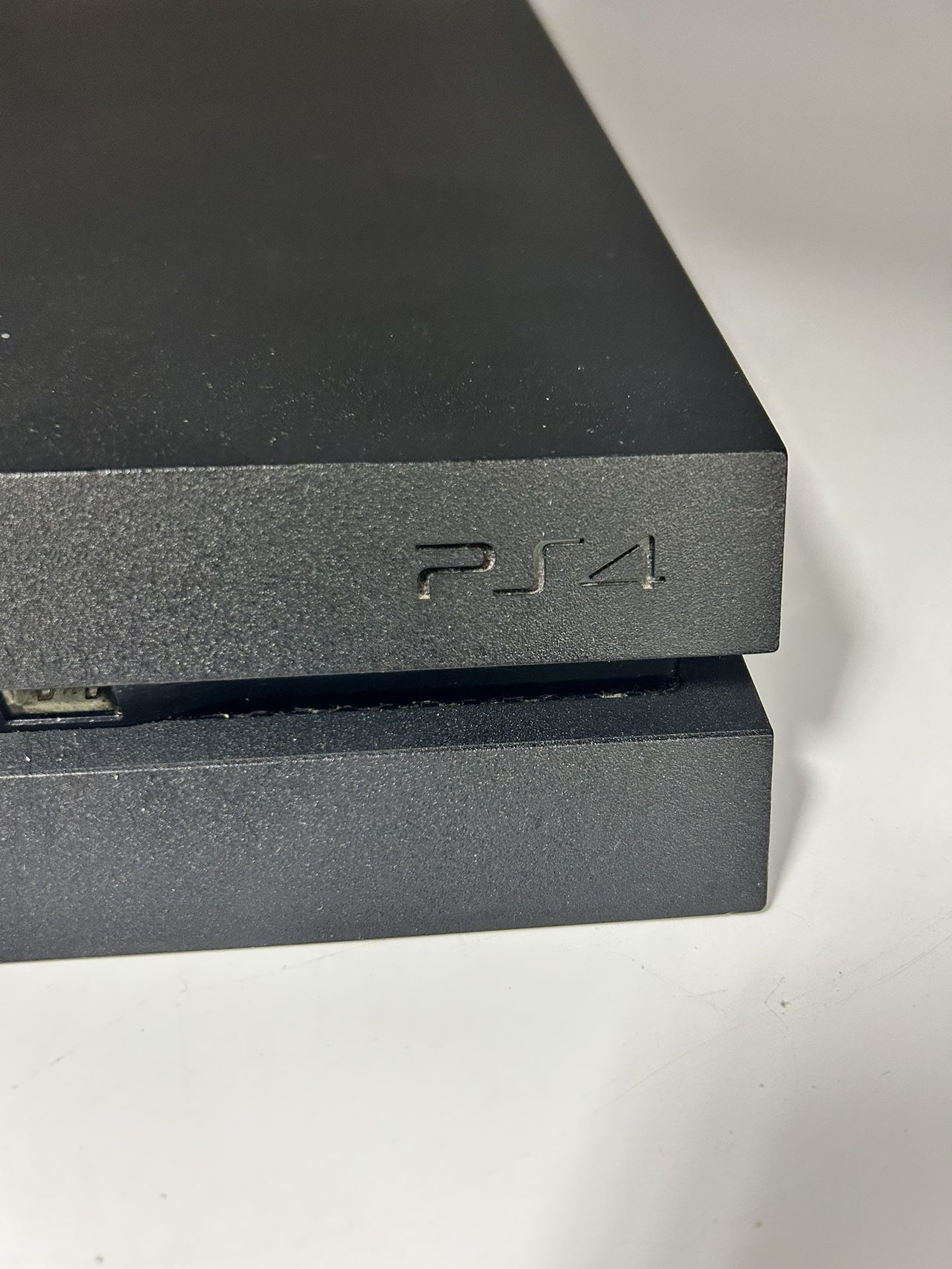 A PS4 Black Slim Console Including Game And Cords! 