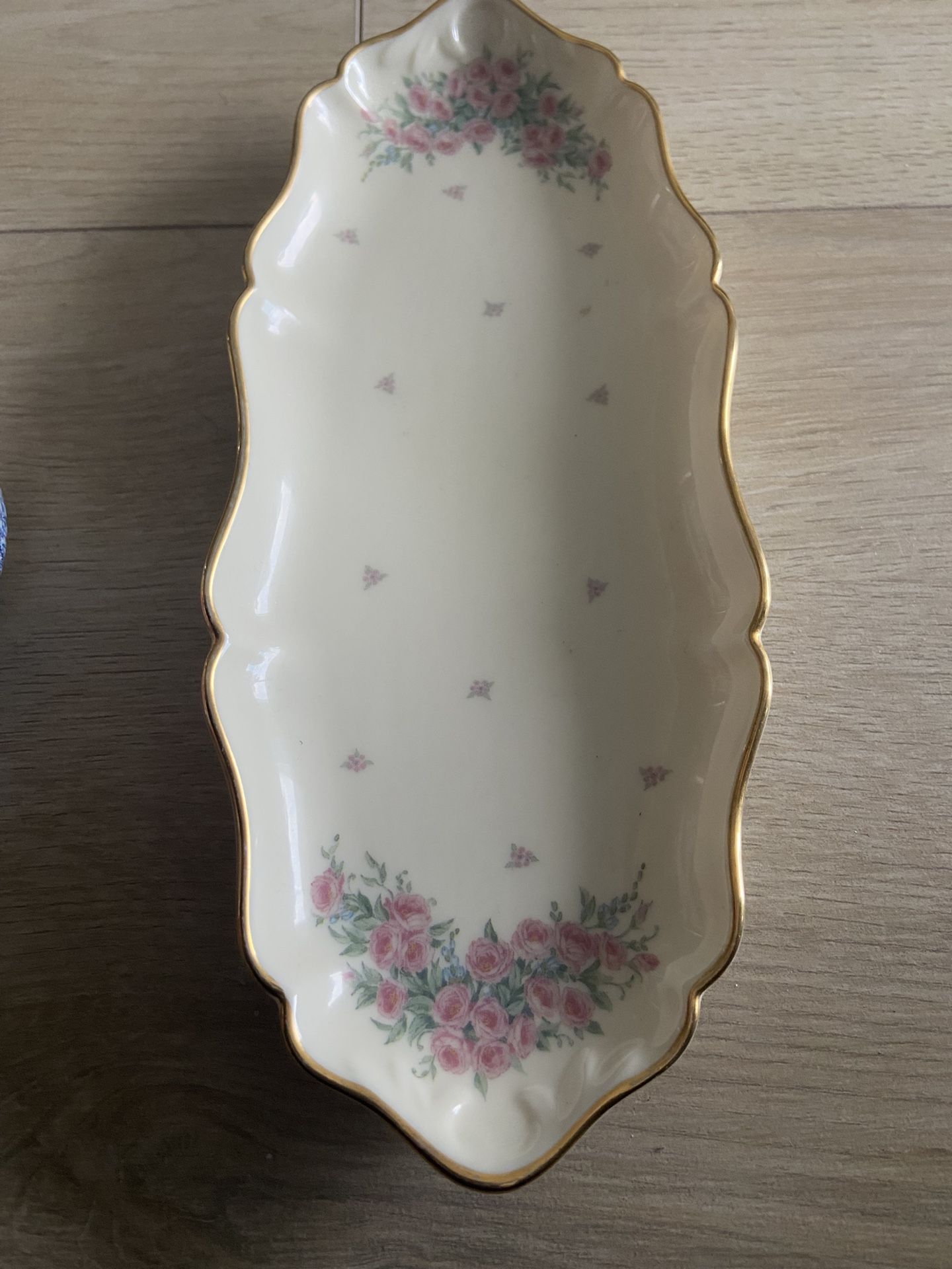 This is a Lenox Petite Rose oval relish dish in ivory porcelain with gold trim