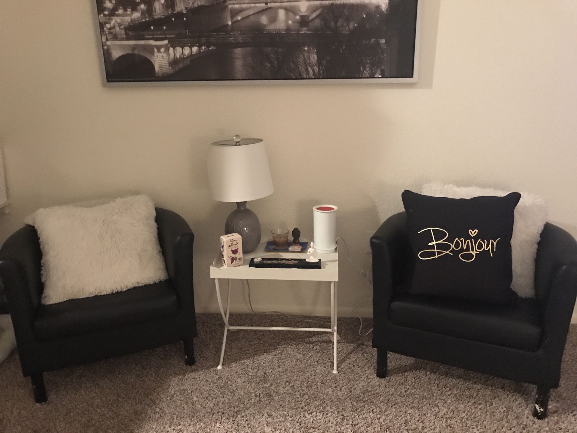 Black leather chairs ($40) and white metal stands ($100)