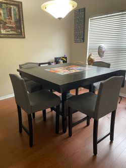 Counter height dining table with spinning Lazy Susan center and 4 chairs. FREE