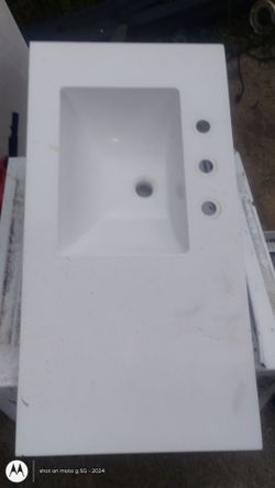 white fiberglass countertop with 8 inch spread  faucet