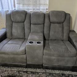 


---

Gray Reclining Sofa – Tampa
3-seat power recliner Sofa With Cup Holders, USB Ports And Center Storage.