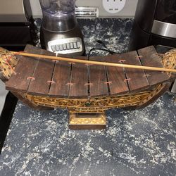 Vintage handmade Thai boat-shaped musical instrument known as a Ranat Ek handcrafted xylophone