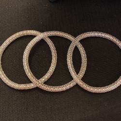 Three silver mesh bangles￼