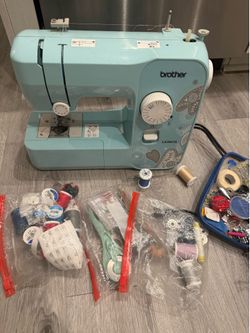 Sewing machine + accessories + fabric + patterns