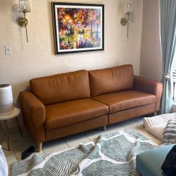 BROWN COUCH. FAUX LEATHER. ALREADY BUILD 