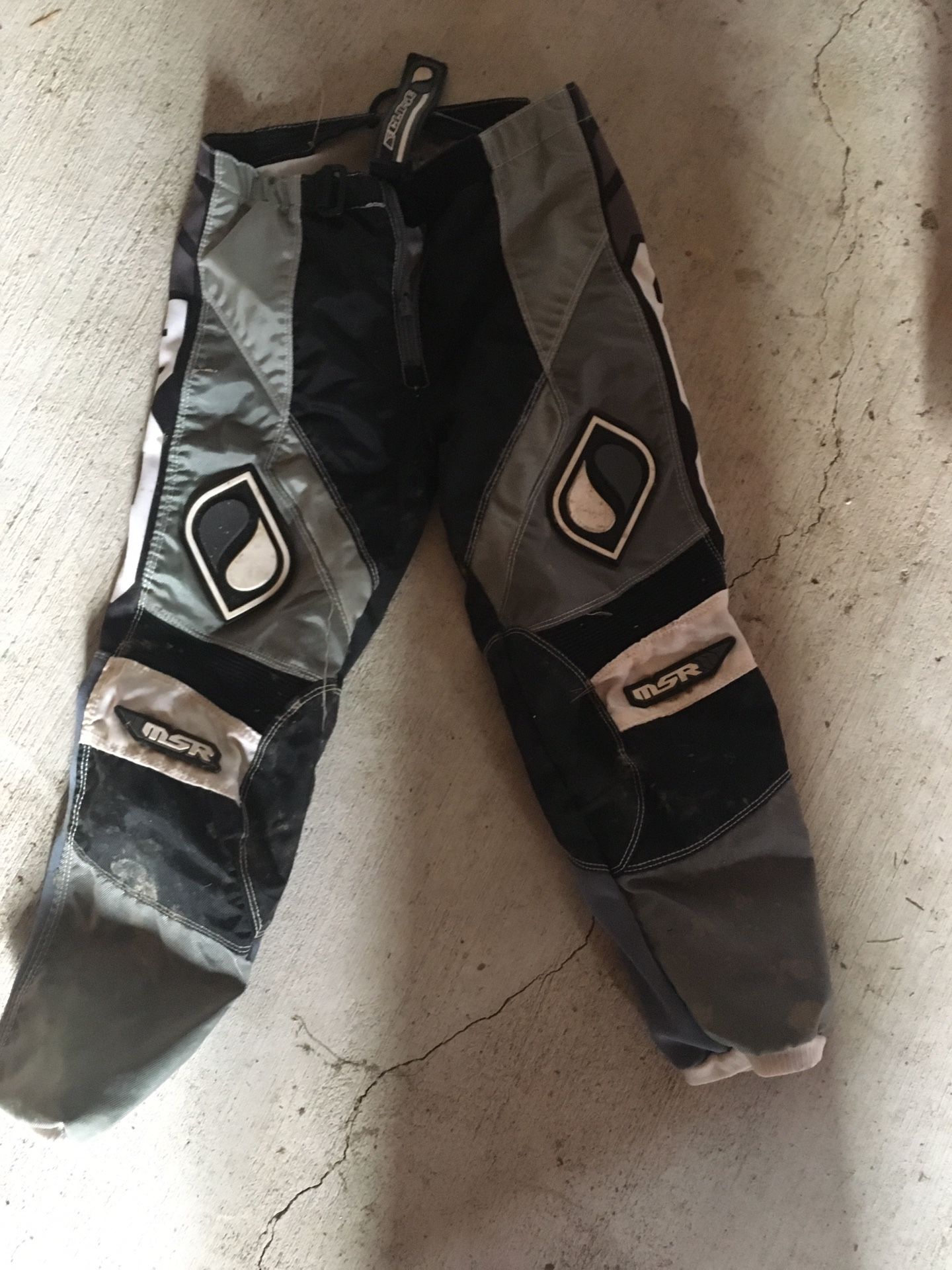 Motocross boots, pants, gloves and shin guards