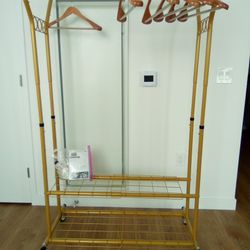 Like New Clothes Rack With Wooden Hangers