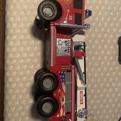 DRIVING AND WATER SHOOTING FIRE TRUCK LIGHTLY USED $30 PRICE NEGOTIABLE 
