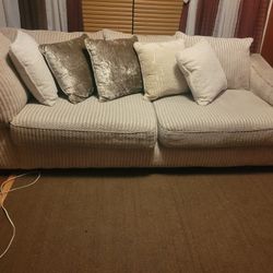 A cream sectional With pillows 600 Dollars