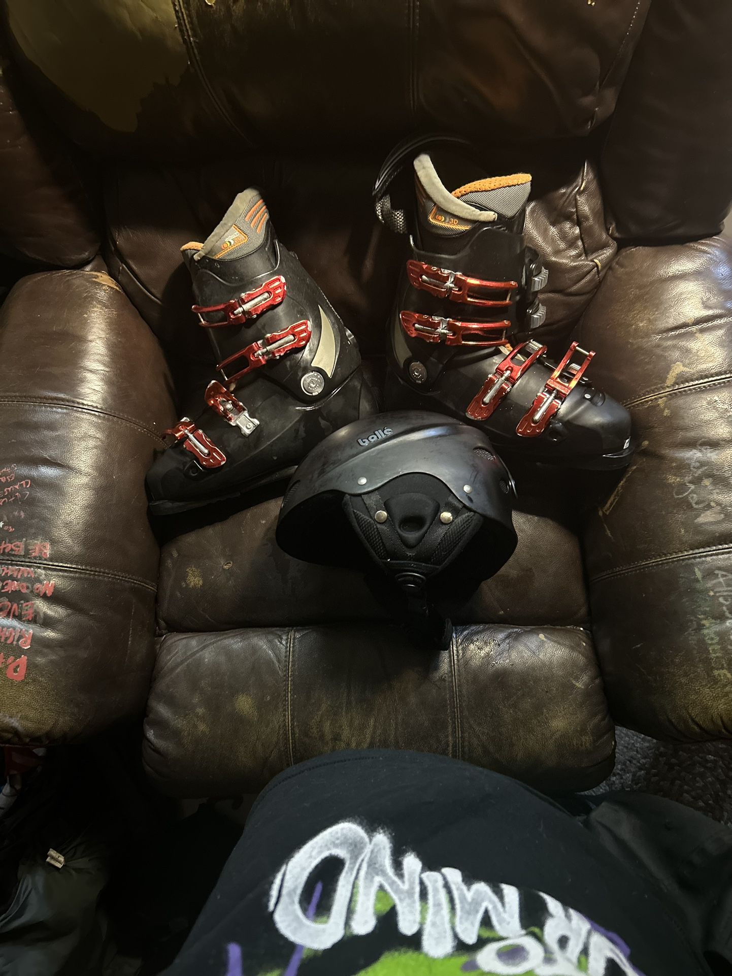Like new Salomon Boots and Bollè black helmet matching K2 skis with bindings 
