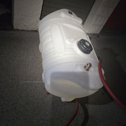 60 Gallon Liquid Storage Tank With Lid And Inlet And Outlet Ports On Bottom With Hoses 