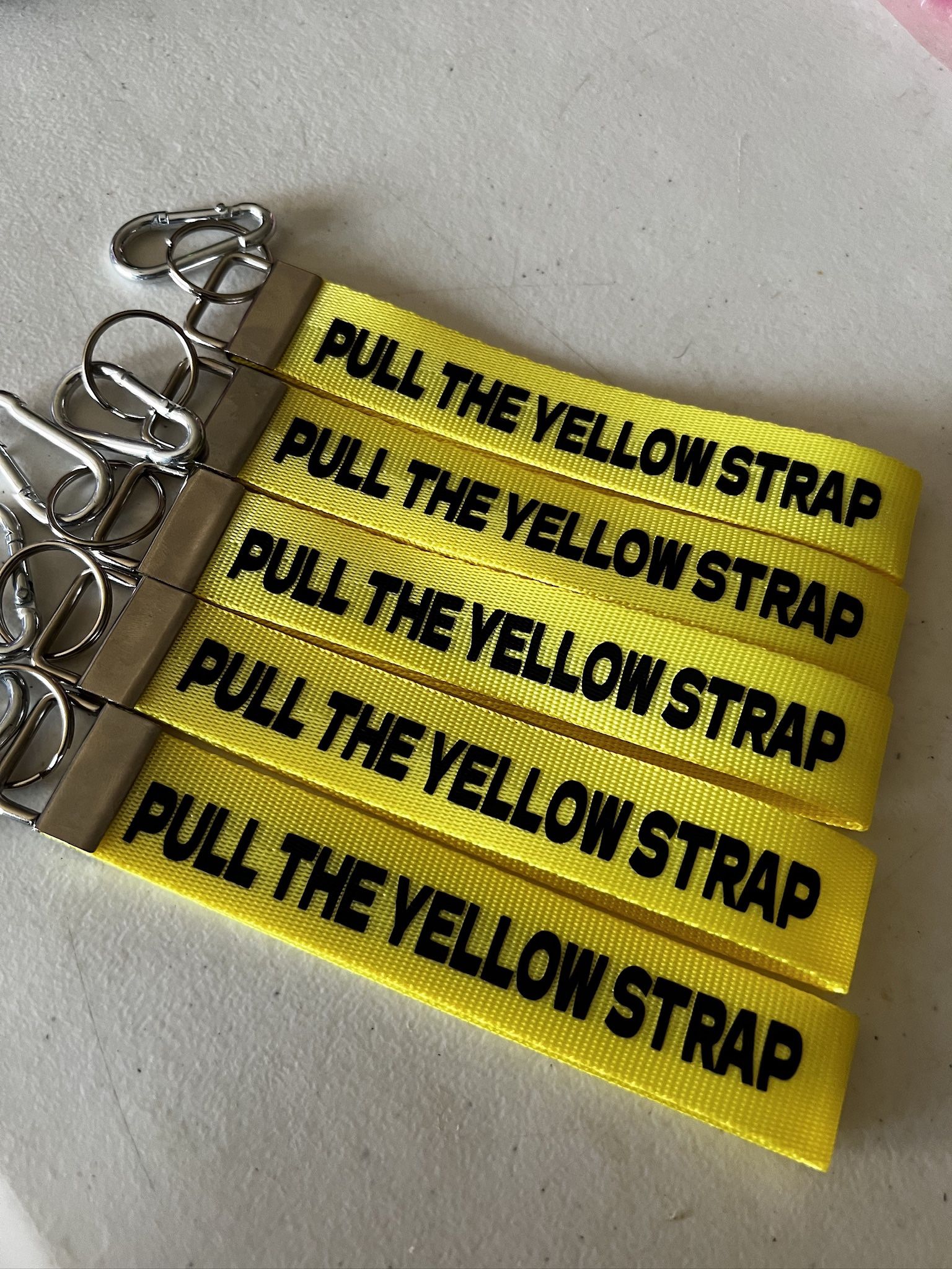 Pull the yellow strap keychain