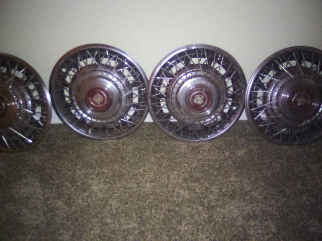 Cadillac Vintage Hubcaps Set( Plus Grill And Other Parts 