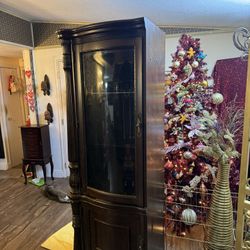 Curio has a light inside two glass shelves $40