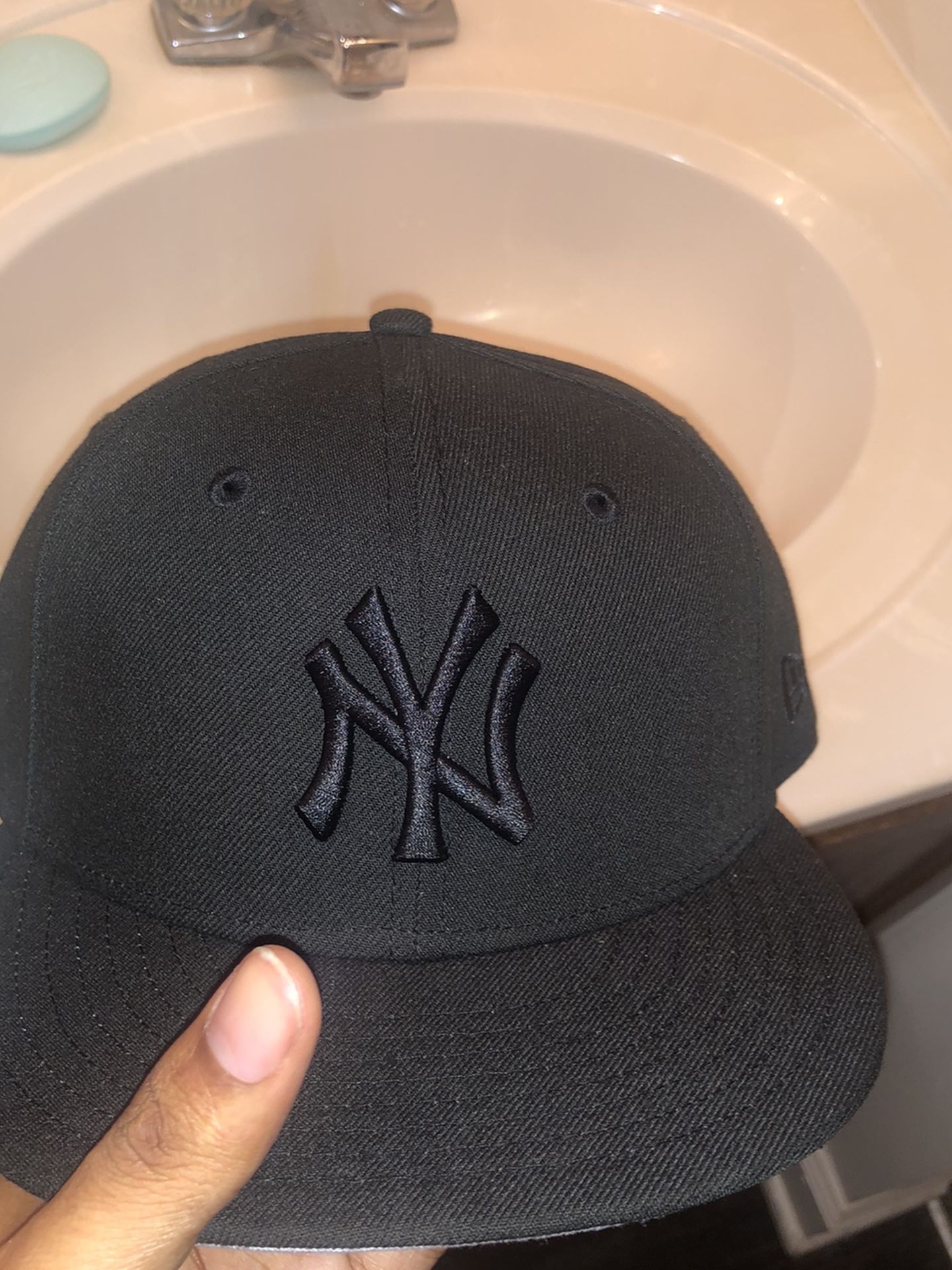 black fitted cap