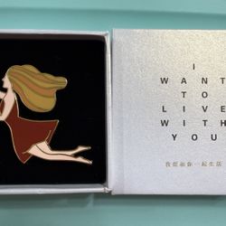 Enamel Pin of Woman in Red Dress with Gift Box