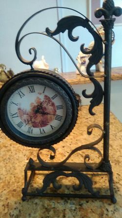 Old swinging clock with a mirror $ 35.00
