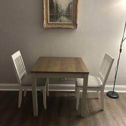 A brand-new, unused table and two chairs