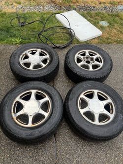 Set of 4 GMC Wheels with Bridgestone Dueler H/T Tires