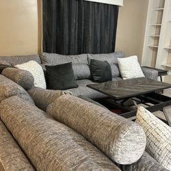 Gray Three Piece Sectional with Coffee Table