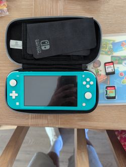 Nintendo Switch Lite With Case And Games