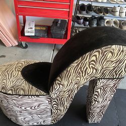 Stiletto animal print lounging chair (44wX37h)… so cute but need a little TLC