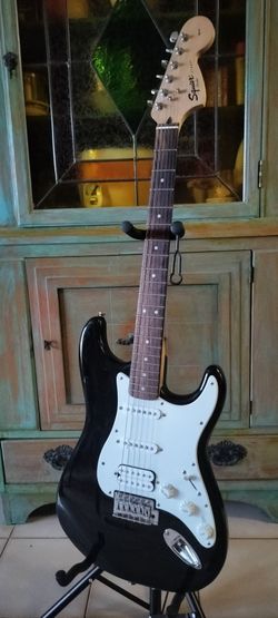 Like new Fender Squier Affinity electric guitar with new bag cable and shoulder strap