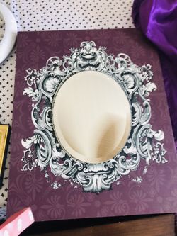 Very good condition purple mirror nice designs great for girls bedroom or anything.