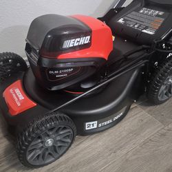 Brand new 54 Volt ECHO lawnmower with bag, 2 batteries and charger.