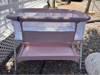 Pink baby bassinet