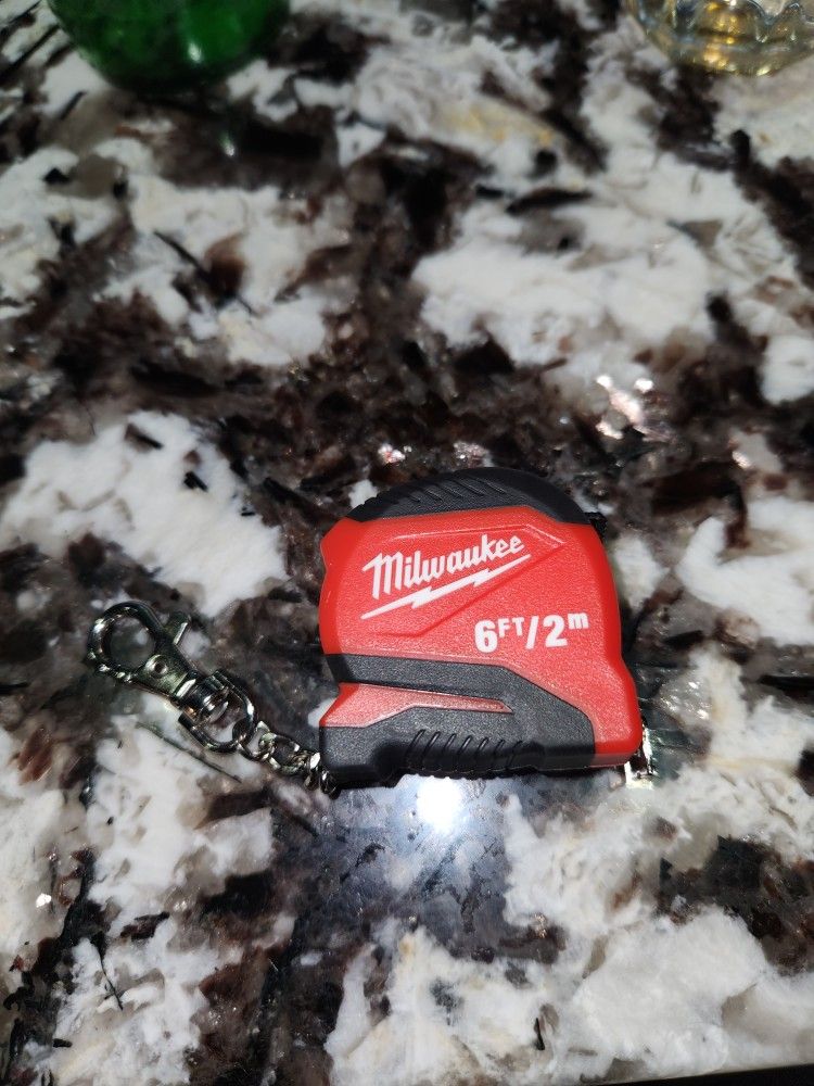 mini Milwaukee brand tape measure