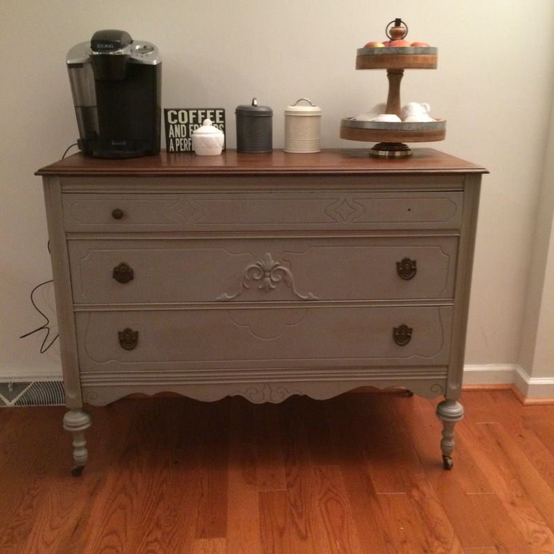 Grayish/tannish coffee bar or dresser. Freshly painted. I have the knob that is missing in the picture. Just need to buy a screw to fit it.