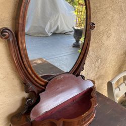 Antique shaving / Vanity mirror.  Some imperfections in the mirror along with a crack repair -see pics. 