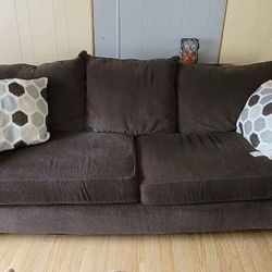  Couch and Couch Table Behind It.