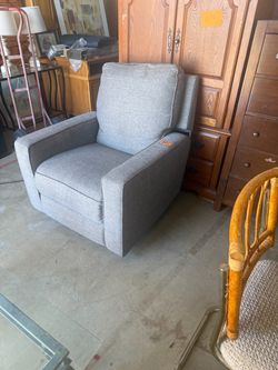 Gray rocker recliner swivels like new