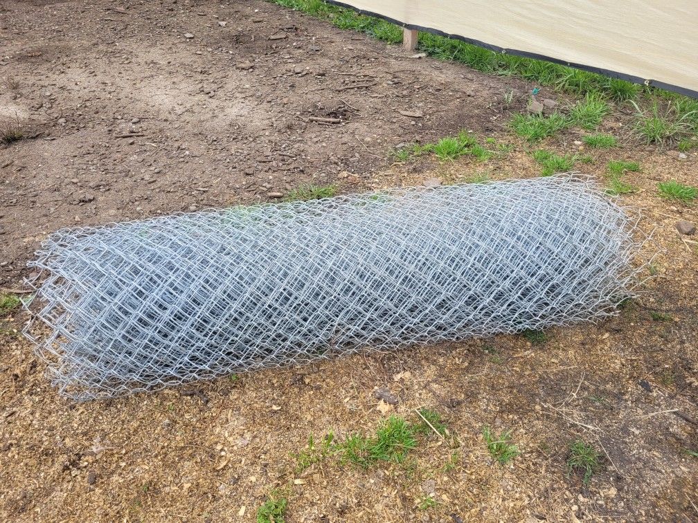Three fifty foot rolls of chain link fence