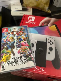 Nintendo Switch Oled + Smash Bros +64gb SD