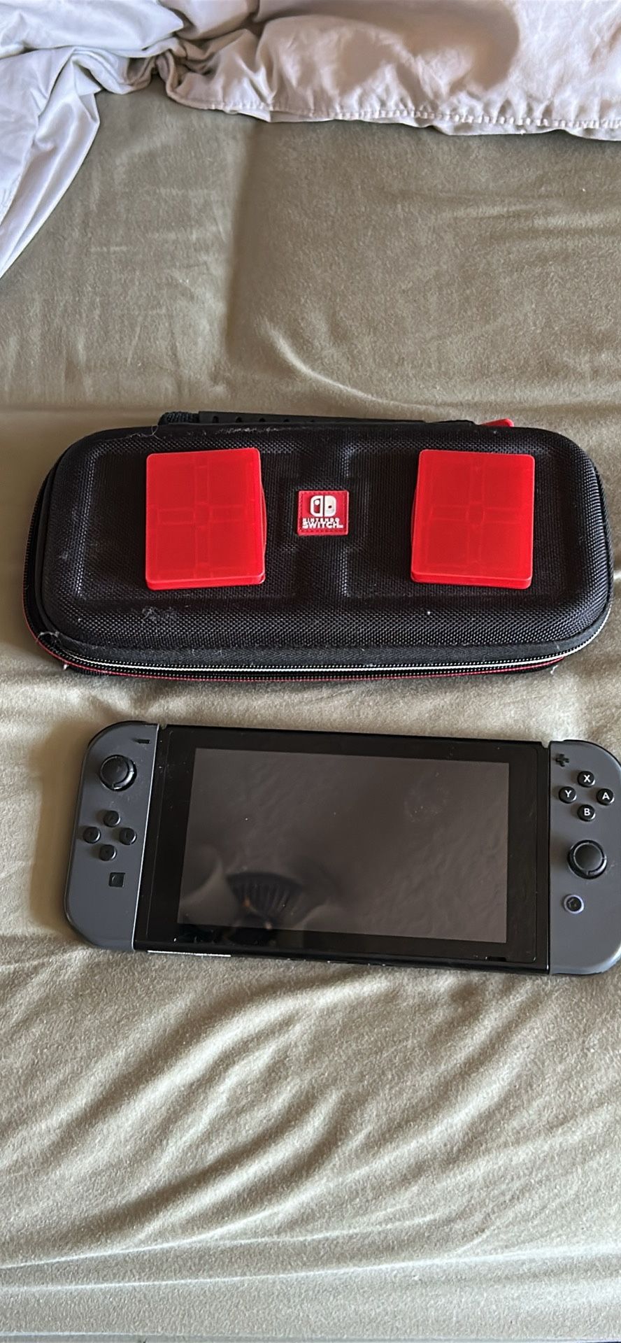 Nintendo Switch with case, charging dock and game holders