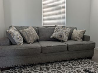 2 pieces gray sofas and loveseat